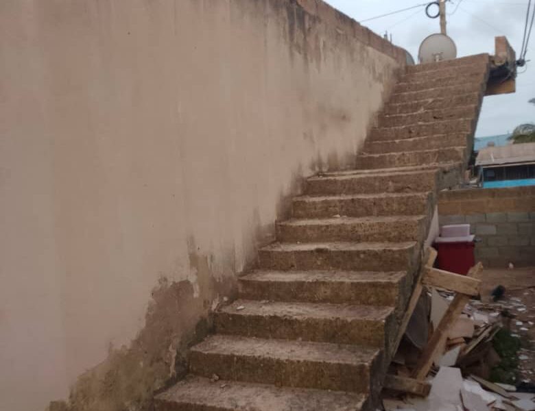 Land with six units of single room self contained for sale